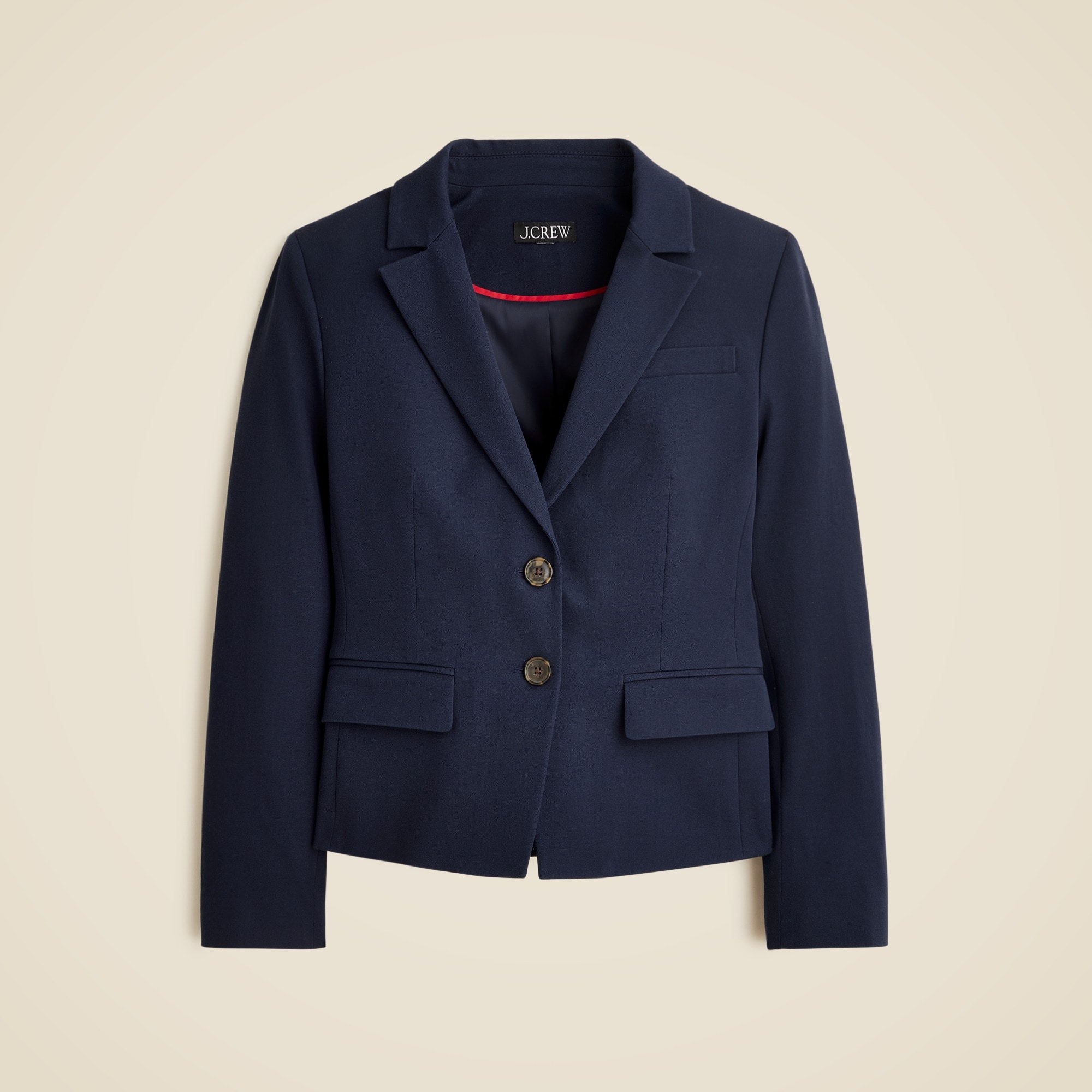 A navy blue women's blazer with a notch lapel, two-button closure, long sleeves, welt pocket with flaps, and lining.